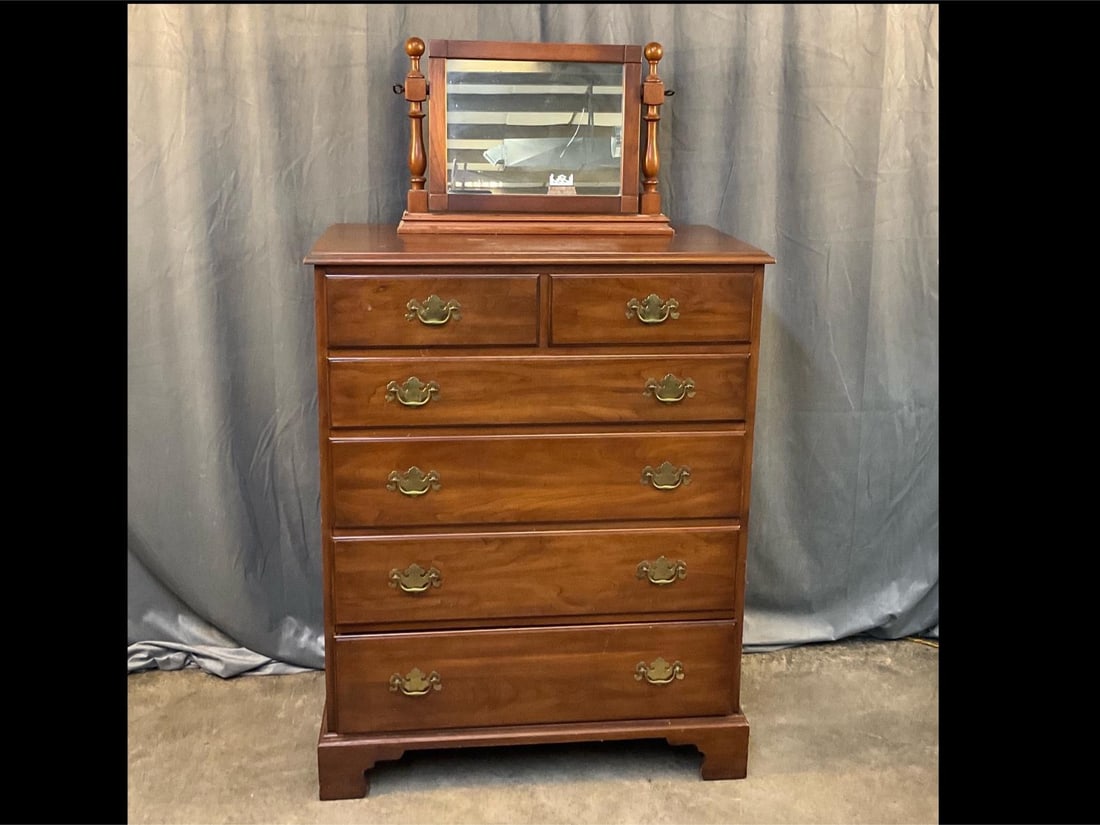 Henkel-Harris Chest of Drawers: Late 20th century Henkel-Harris Cherry Chippendale Style Chest with two drawers over four and freestanding mirror. Drawers with dust boards. Top has several blemishes and scratches, otherwise good