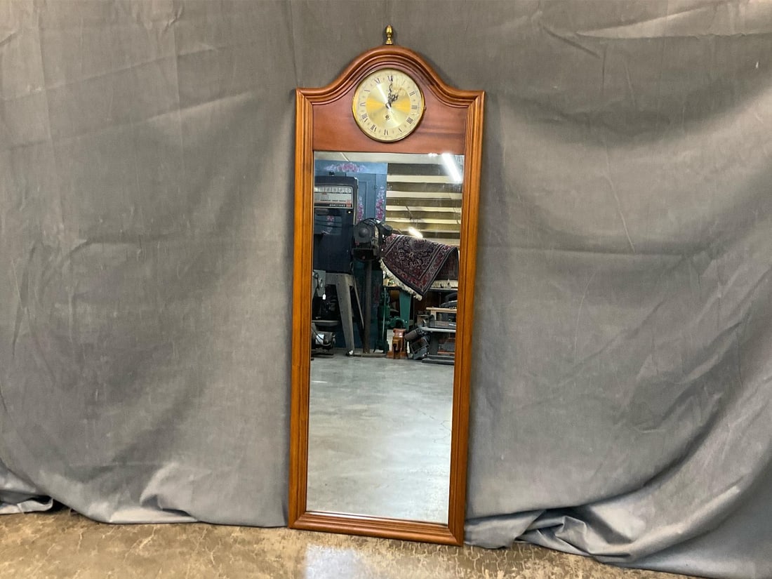 Wall Mirror/Clock: 1960's-1970's Basset Mirror Company Eight Day Wall Clock/Mirror. Clock does not work, broken Fast/Slow adjustment lever, otherwise good condition. Measures 16.25 inches wide x 1.25 x 45 inches tall.