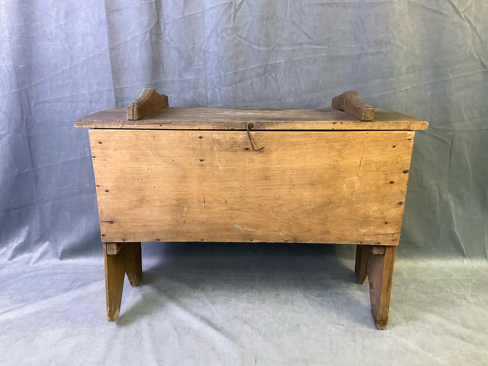 Meal Bin: Late 19th century oak and poplar meal bin with boot jack ends, divided internal storage and natural weathered surface. Some loss to feet and crack on side. Measures 24 inches wide x 11 x 19.5 inches