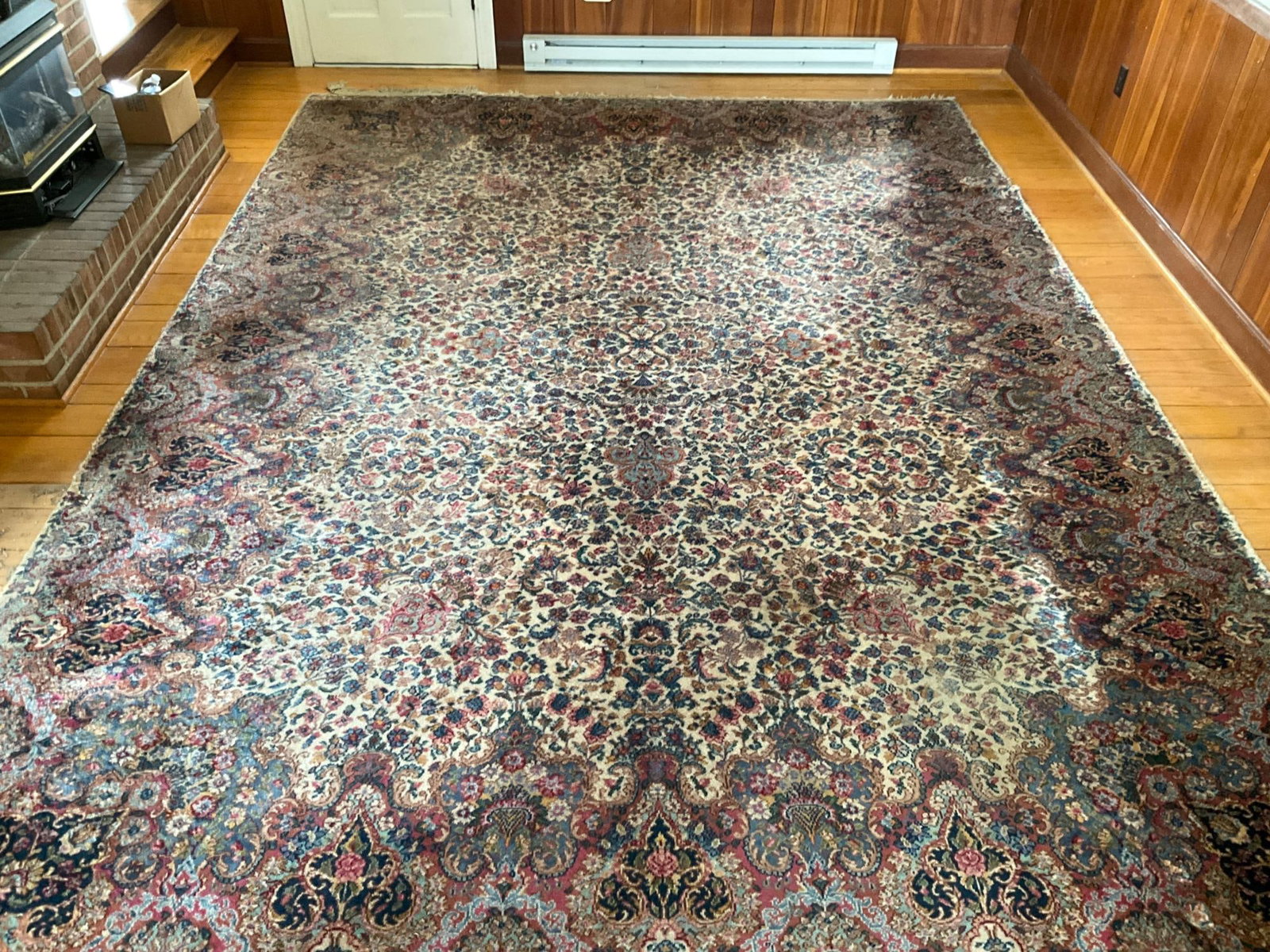 Persian Carpet: Mid-20th century Persian Tabriz Style carpet. Areas of wear, staining, and some areas of fringe loss. Measures 169 inches x 120 inches.
