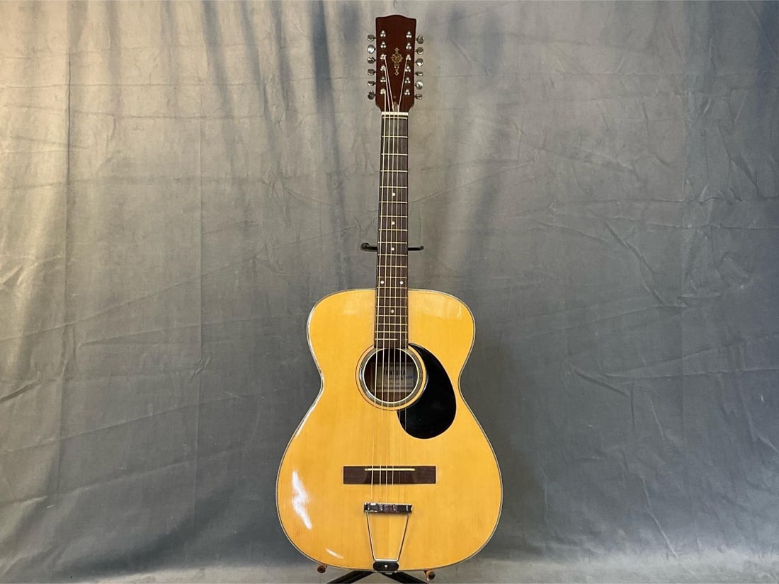 Ventura Twelve String Acoustic Guitar: Circa 1970 Ventura Twelve String Guitar Bruno Model V-1590/Serial Number C 12336. Good condition. Measures 15.25 inches wide x 3.75 x 40 inches tall.