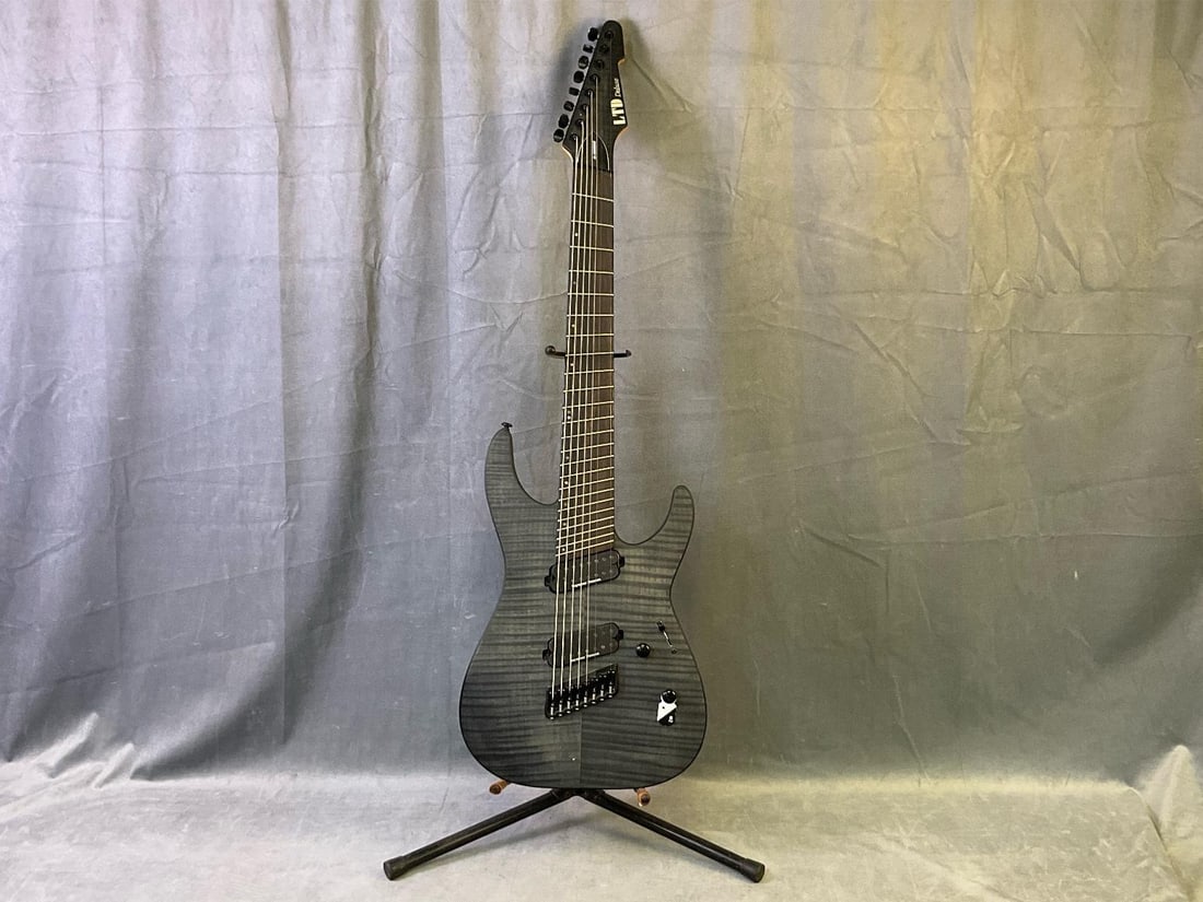 Electric Guitar ESP LTD: ESP LTD Deluxe m-1008ms solid body eight string electric guitar. Jumbo fretboard with abalone inlay and maple - mahogany neck. Set of Duncan pickups. Serial number IW20060275. Case included. Several