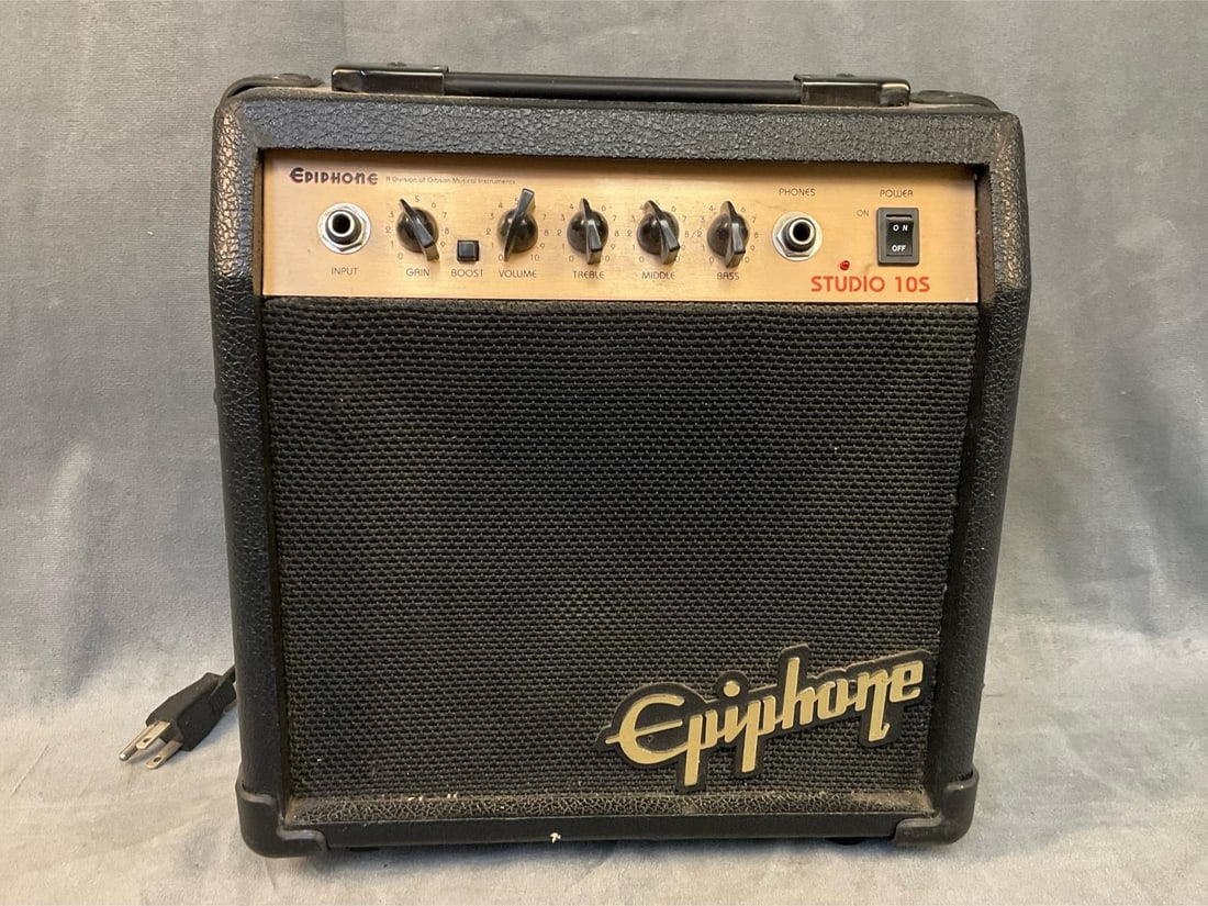 Epiphone Guitar Amplifier: Late twentieth century vintage Epiphone Studio 105 electric guitar amplifier. Tested, works, good condition. Measures 11.25 inches wide x 4 x 12 inches tall.