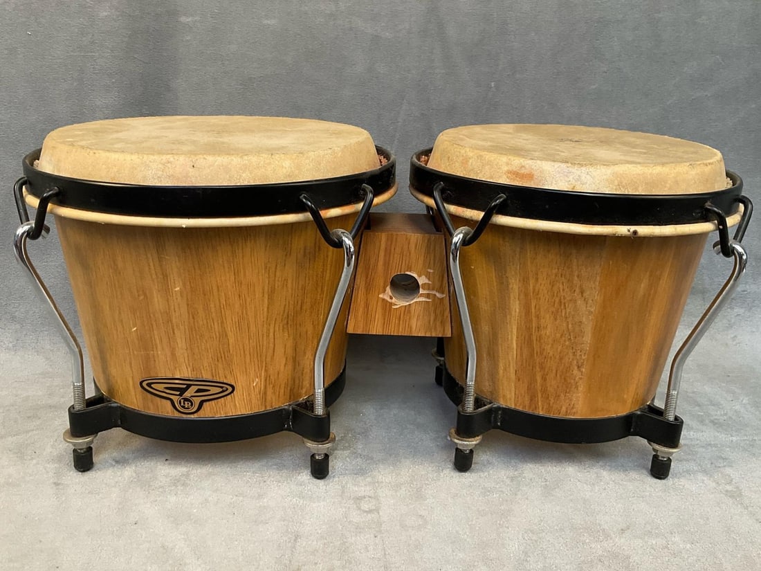 Bongo Drums: Circa 2000 Cosmic Percussion Latin Percussion Bongo drums. Used, good condition. Measures 15.5 inches wide x 7.5 x 7 inches tall.