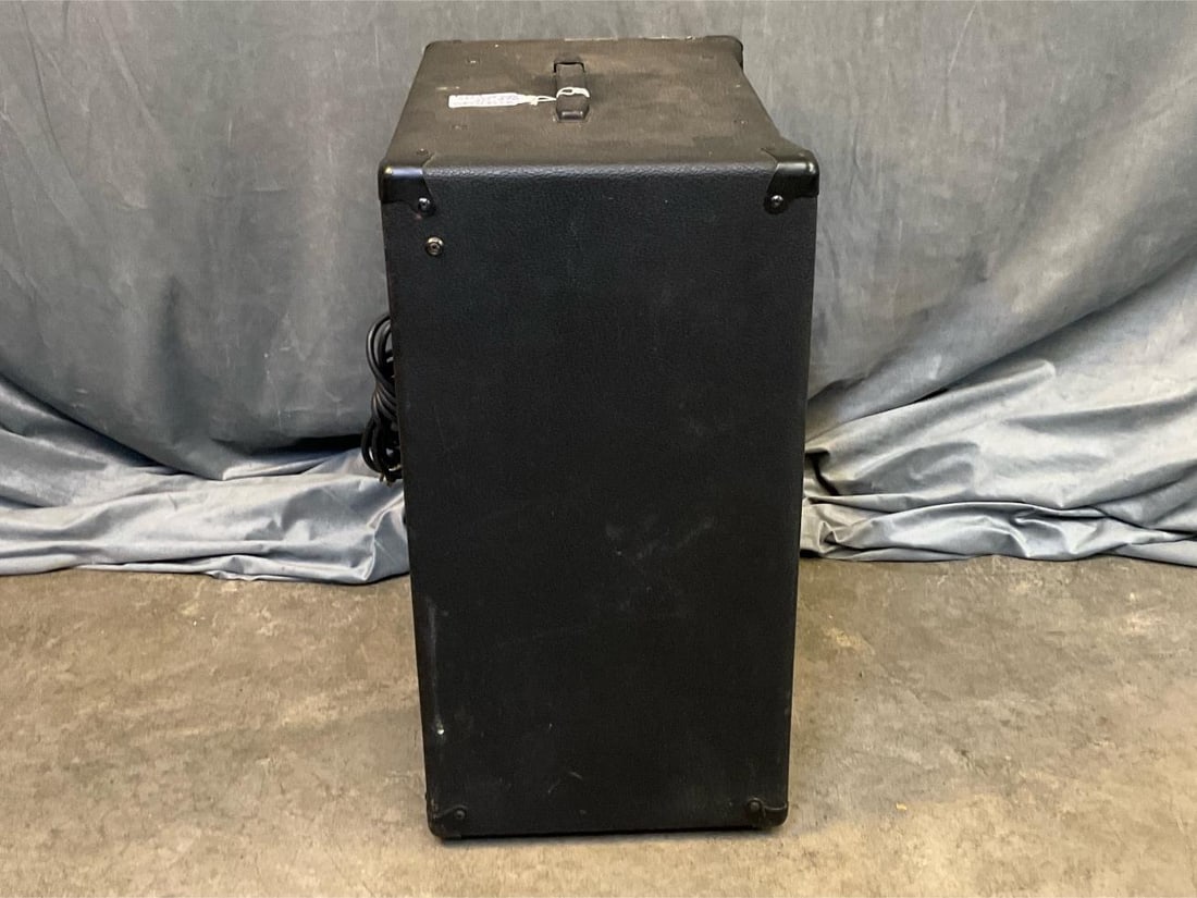 Fender Bass Amp: Fender Bass Extended Range BXR 100 Amplifier. Serial number LO- 446659. Made in USA. Surface scratches and soiled with various stains. Otherwise good condition. Tested and working. Measures 21 inches