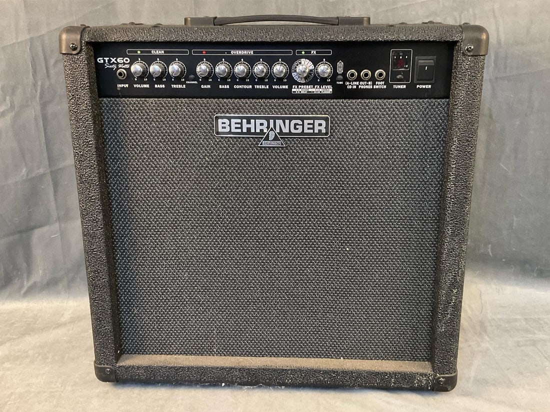 Behringer Guitar Amplifier: Early 2000's Behringer GTX60 Sixty Watts Guitar Amplifier with Bugera speaker and Behringer foot pedal. Powers on, not tested. Good condition. Measures 20.75 inches wide x 10.5 x 19.75 inches tall.