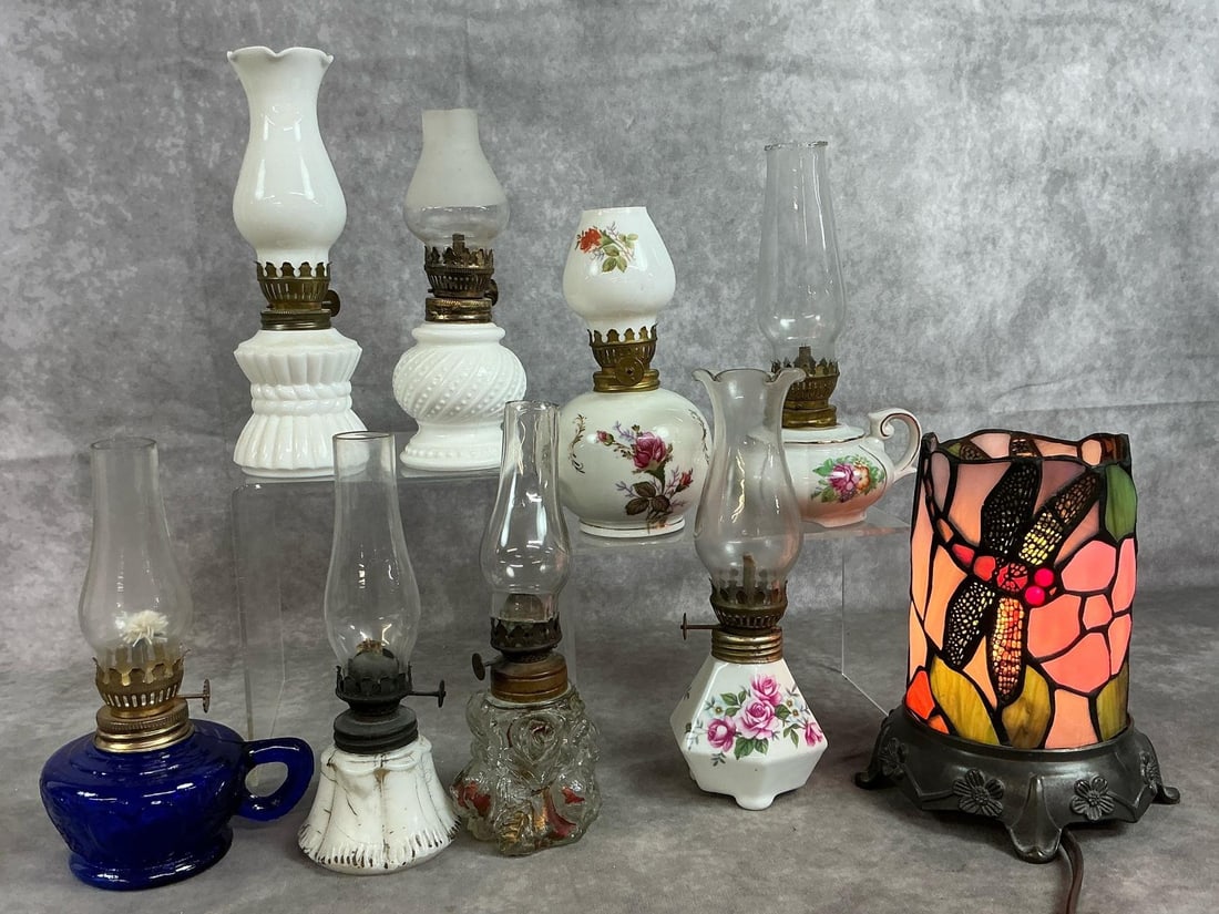 Miniature Oil Lamps & Stained Glass Light: Eight mini early to mid 1900's oil lamps and stained glass accent lamp. Milk glass, cobalt glass, three pink rose mini lamps, and more. Dragonfly stained glass electric accent lamp with metal base.