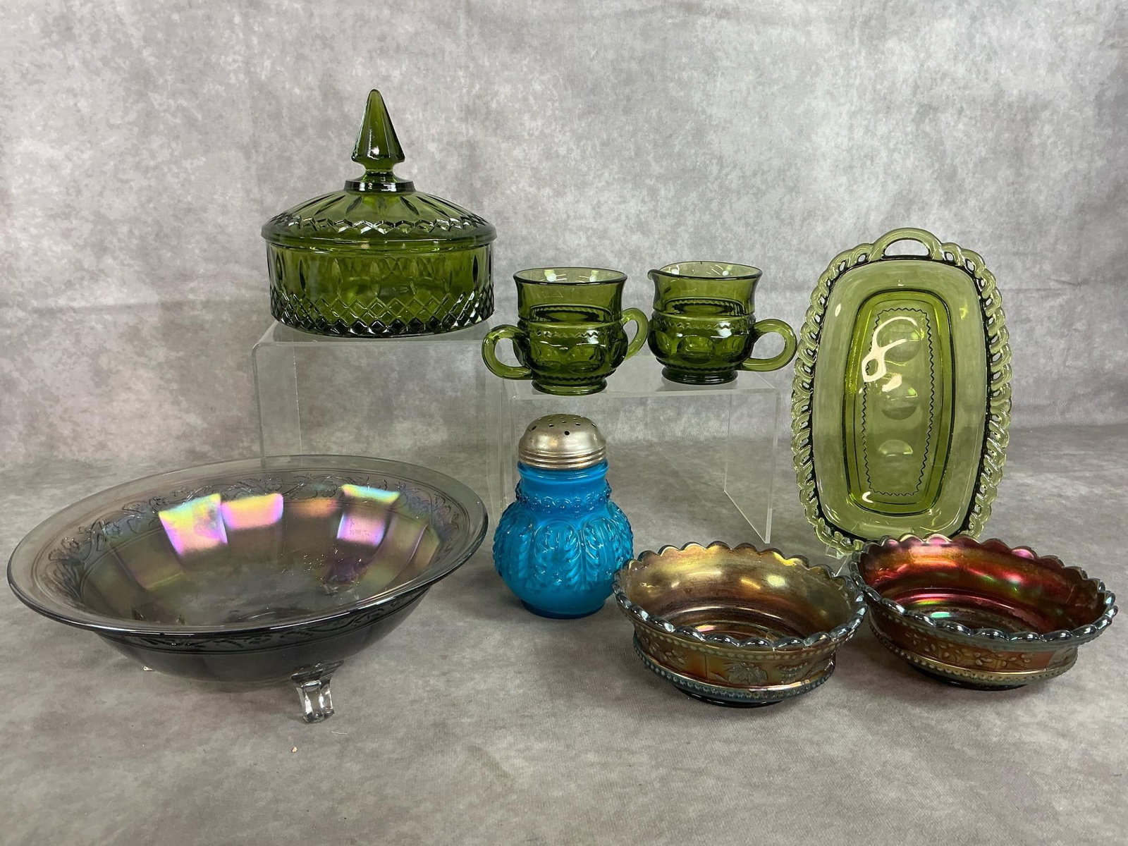 Collectible Carnival & Indiana Glass: Eight early to late 1900's collectible glass pieces. Avocado Indiana Glass candy dish, sugar & creamer, and tray. Includes blue Early American Pattern glass sugar shaker, two Carnival Grapes and