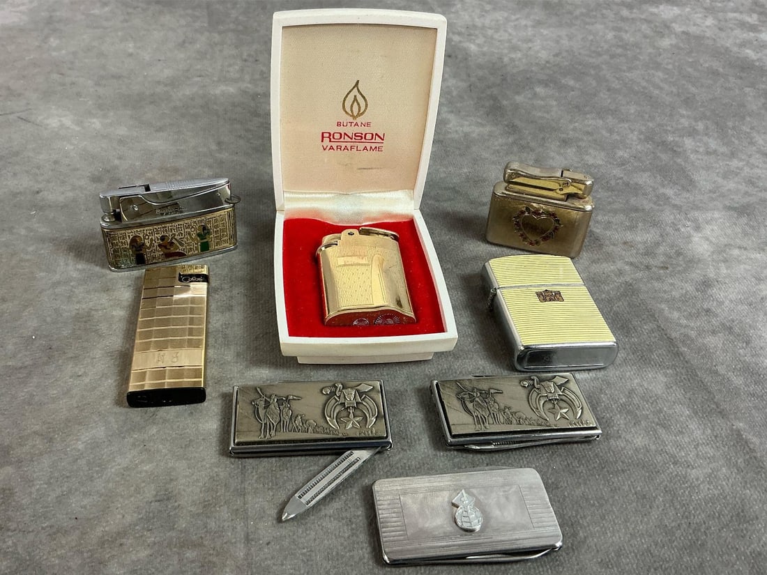 Cigarette Lighters & Money Clips: Five lighters and 3 clips from late 1900's. Lighters include a boxed Ronson Varaflame, Kreisler, Brother Lite, and Hadser. Silver earth emblem and two Harry Klitzner Masonic Shriners money clip with