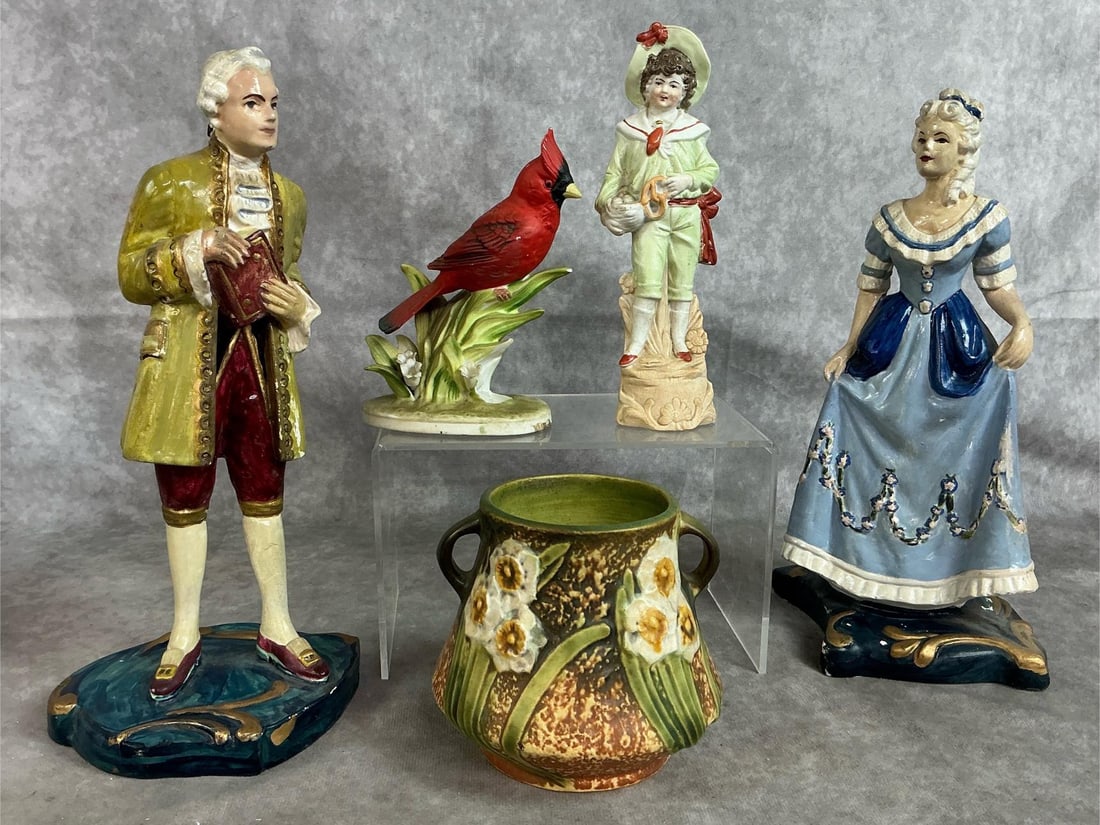 Roseville Vase & Figurines: Five early to mid 1900's pieces. Roseville Jonquil vase, hand painted ceramic Colonial gentleman and lady, porcelain boy in sailor suit, and cardinal. Some paint loss on figurines and slight crazing.