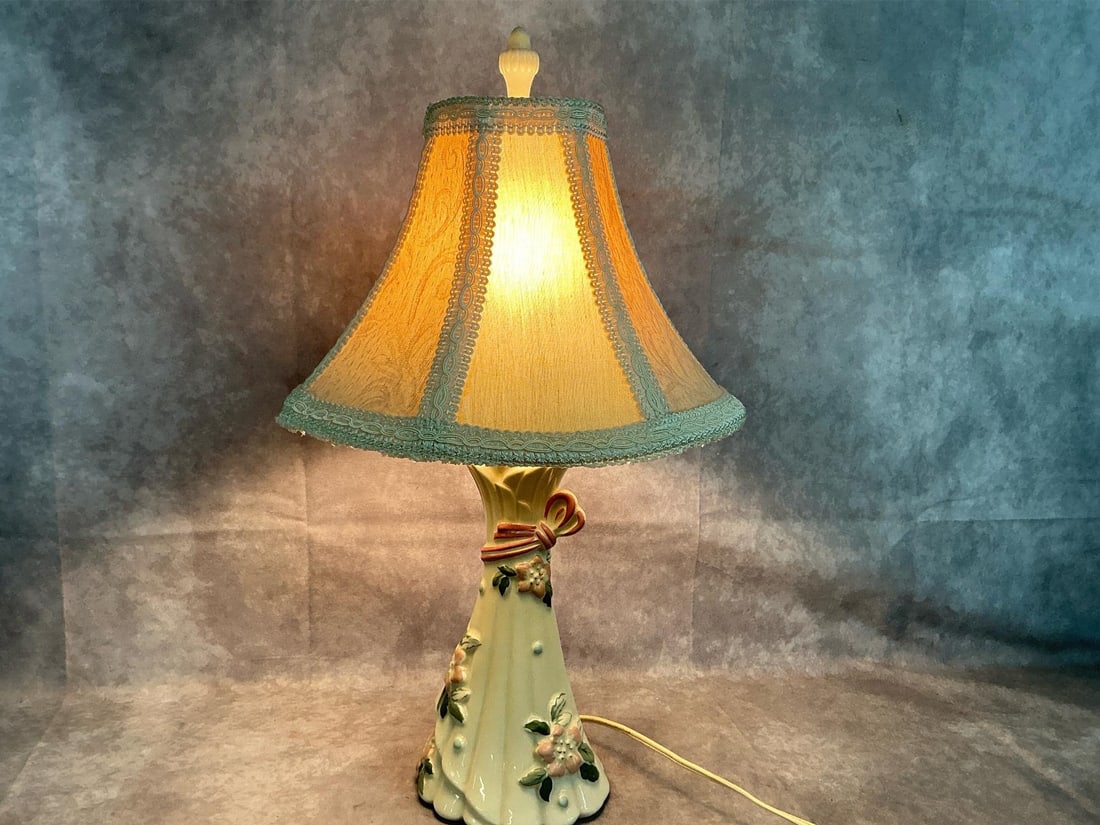 Boudoir Lamp: 1940's ornate lamp and shade. William F B Johnson cream colored flared design with pink flowers and bow. In good condition. Measures 5.5 inches at base x 20 inches tall.