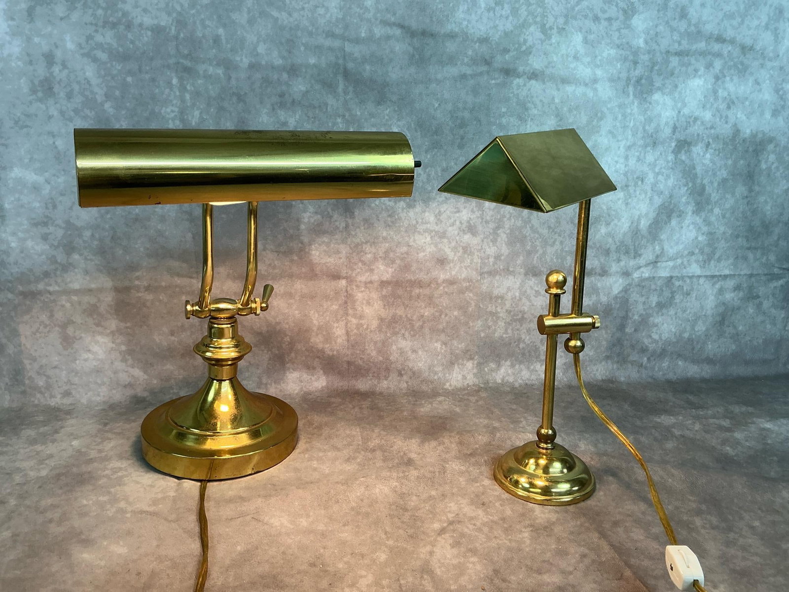 Brass Piano/Desk Lamps: Two vintage brass adjustable lamps. Desk or piano lamps. In good condition. Largest measures 6.5 inches in diameter at base x 12 inches tall.