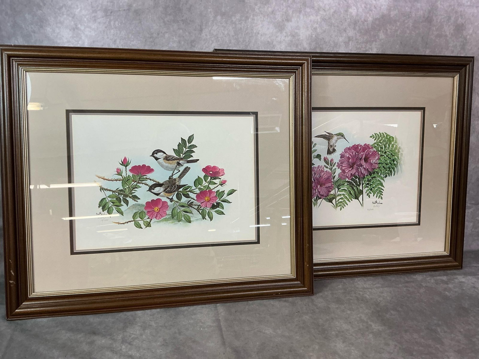 Floral & Birds Framed Prints: Two 1998 prints. Hummingbirds and flowers signed by Dan Balke #42/1500, and sparrows and flowers signed by Balke #19/1500. Framed and matted. Scratched frame, otherwise in good condition. Measures 25