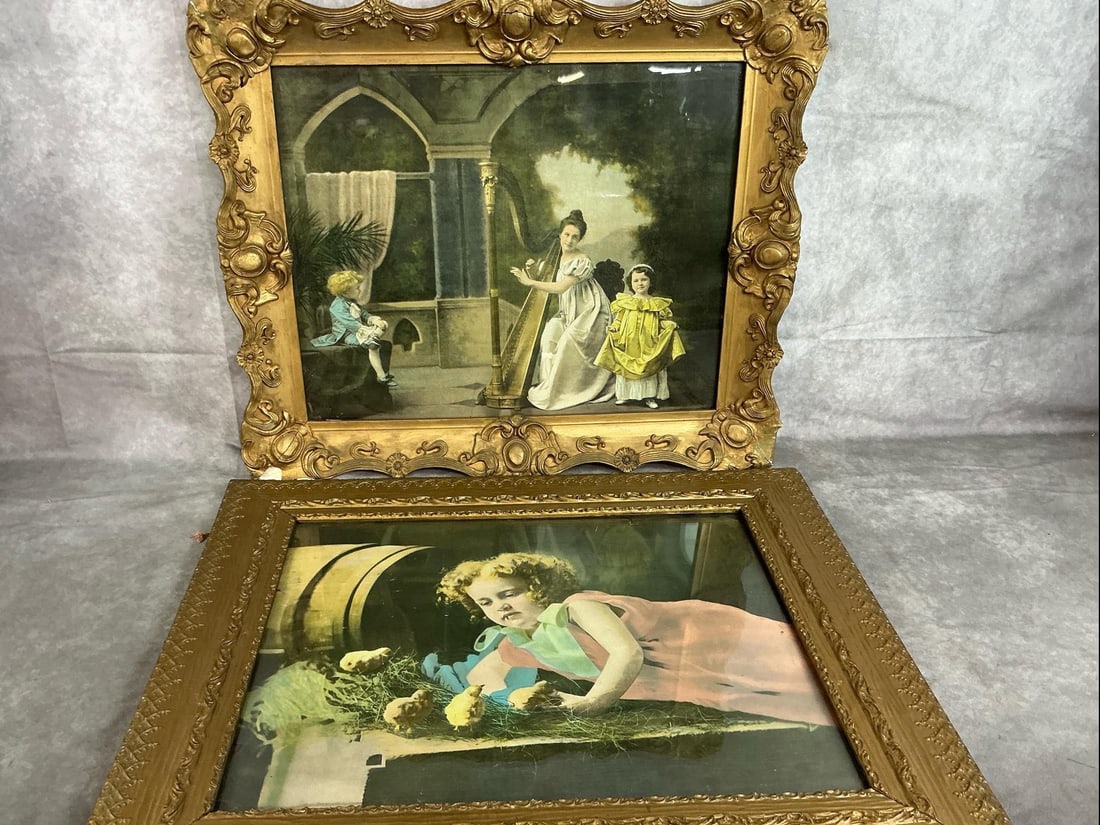 Antique Framed Prints: Two Victorian prints in ornate frames. Woman with children, playing harp, and girl with chicks. Some frame damage and a spot on child's mouth. Woman with harp measures 25 inches wide x 2 x 21 inches t