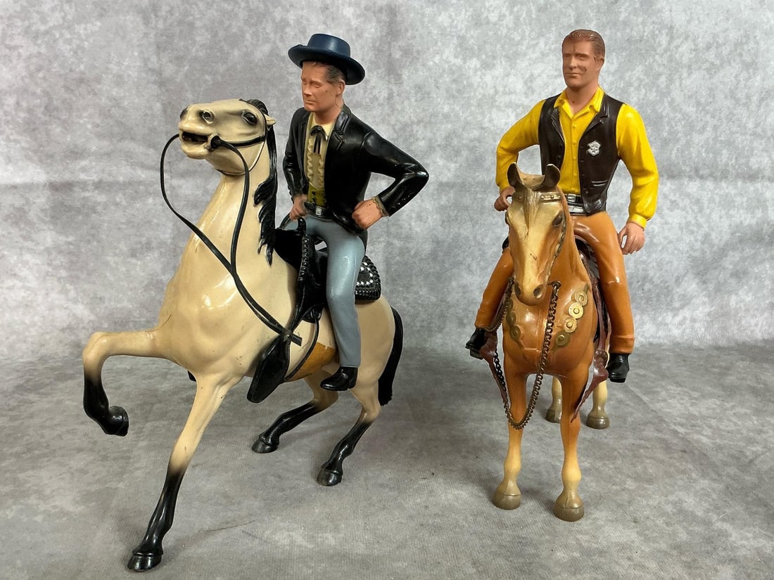 Cowboys and Horses: Two 1950's toy horses and riders. Gold colored horse with "Matt Dillon from Gunsmoke" by Hartland. Tan and black horse with "Paladin from Have Gun, Will Travel." A few marks on figures, otherwise in