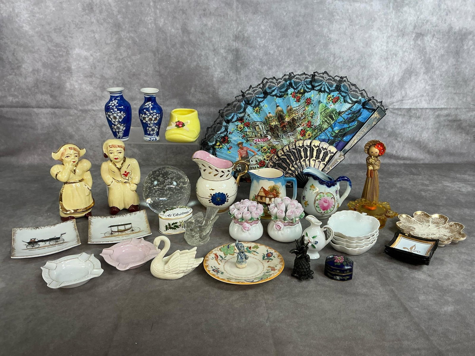 Miniature Pitchers, Dishes, Figurines & More: Thirty-four mid to late 1900's small collectibles. Falconware England pitcher, Louis XV beige and pink pitcher, Lenox porcelain swan place card holder, Dutch boy & girl salt and pepper set, mini