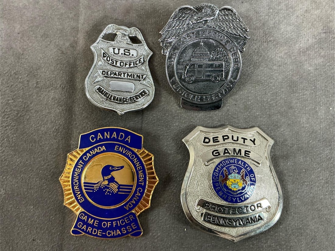 Vintage Badges: Four vintage badges. Includes US Post Office Maintenance Service and Vehicle Service, Canada Game Officer, and PA Deputy Game Protector. In good condition. Deputy Game measures 2.25 inches wide x 2.5
