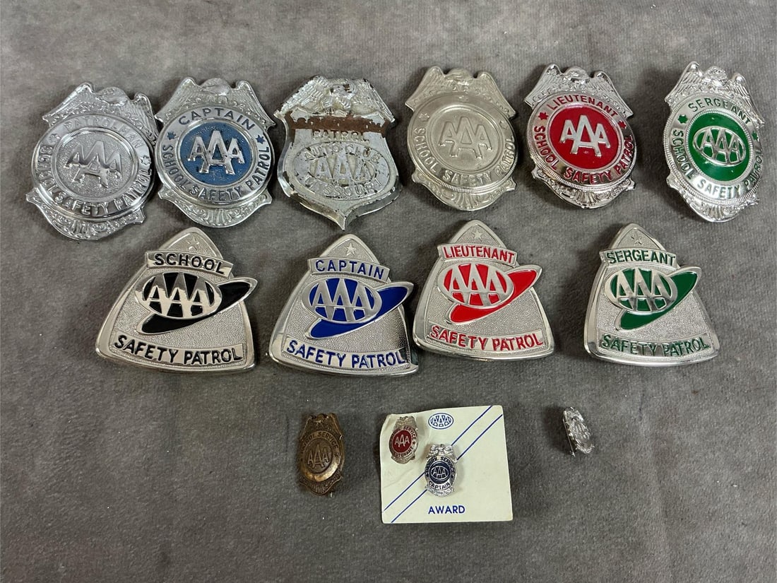 AAA Safety Patrol Badges: Fourteen vintage AAA badges. Ten large Safety Patrol Badges and four small badges. One has rust and one is tarnished, otherwise in good condition. Triangular badge measures 2.25 inches wide x 2.25