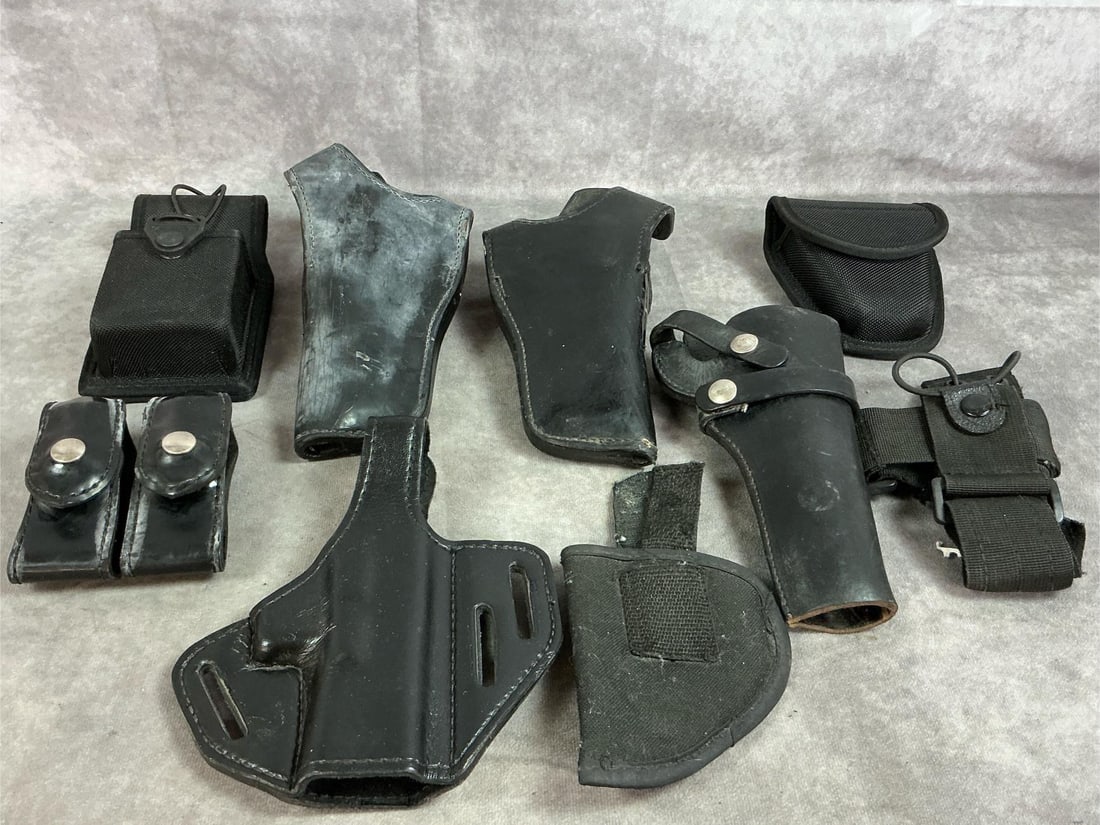 Gun Holsters, Pouches, & Cases: Nine late 1900's black leather and nylon holsters and cases. Two Gould and Goodrich holsters and a pancake holster. Ammo pouch and Hunters 1100B holster. Nylon swivel radio case and more. Larger