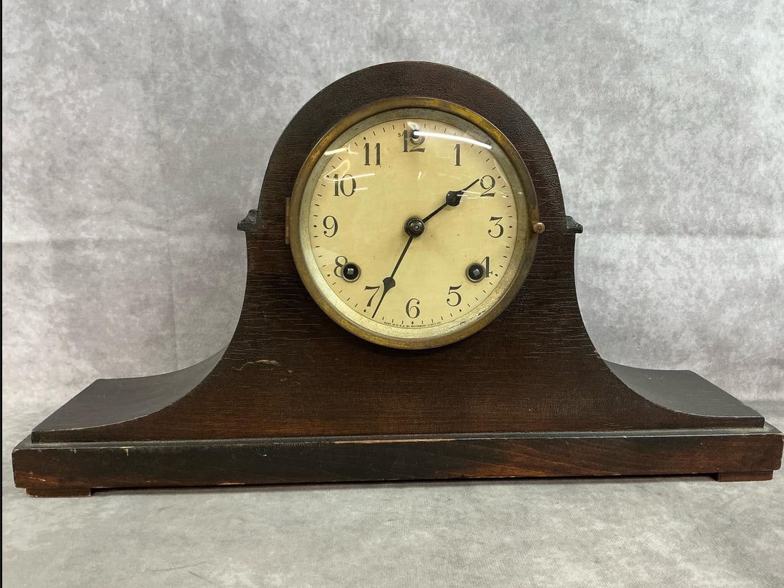 Waterbury Mantle Clock: Mid 1900's mantle clock. Waterbury Clock Company with wind up key and pendulum. Tarnished clock face frame, otherwise in good condition. Clock untested. Measures 18 inches wide x 4.25 x 10 inches
