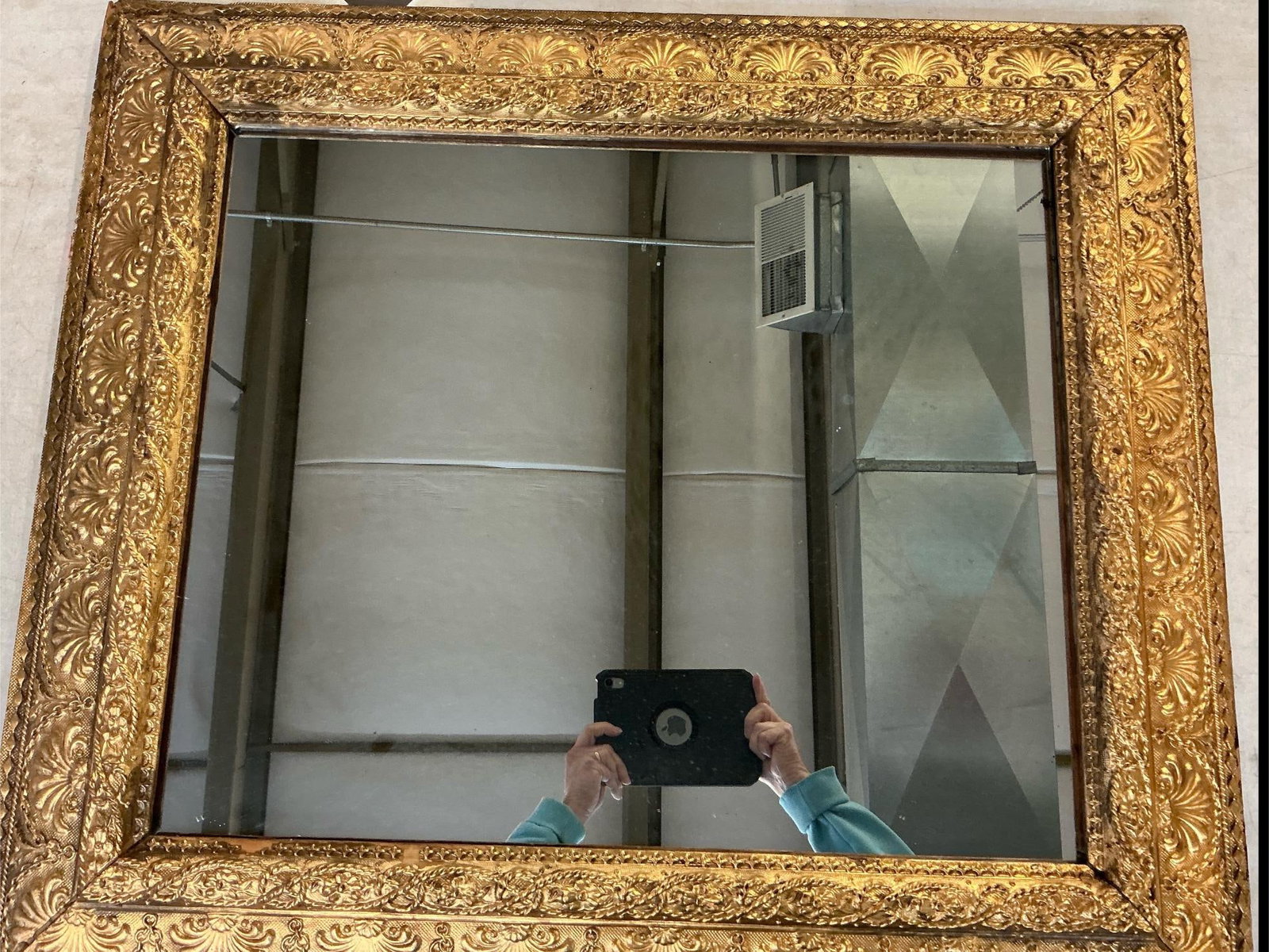 Antique Mirror: Antique gold framed mirror. Ornate frame with a few chips and slight discoloration. Glass is slightly loose from frame. Measures 32 inches wide x 2 x 27.5 inches tall.