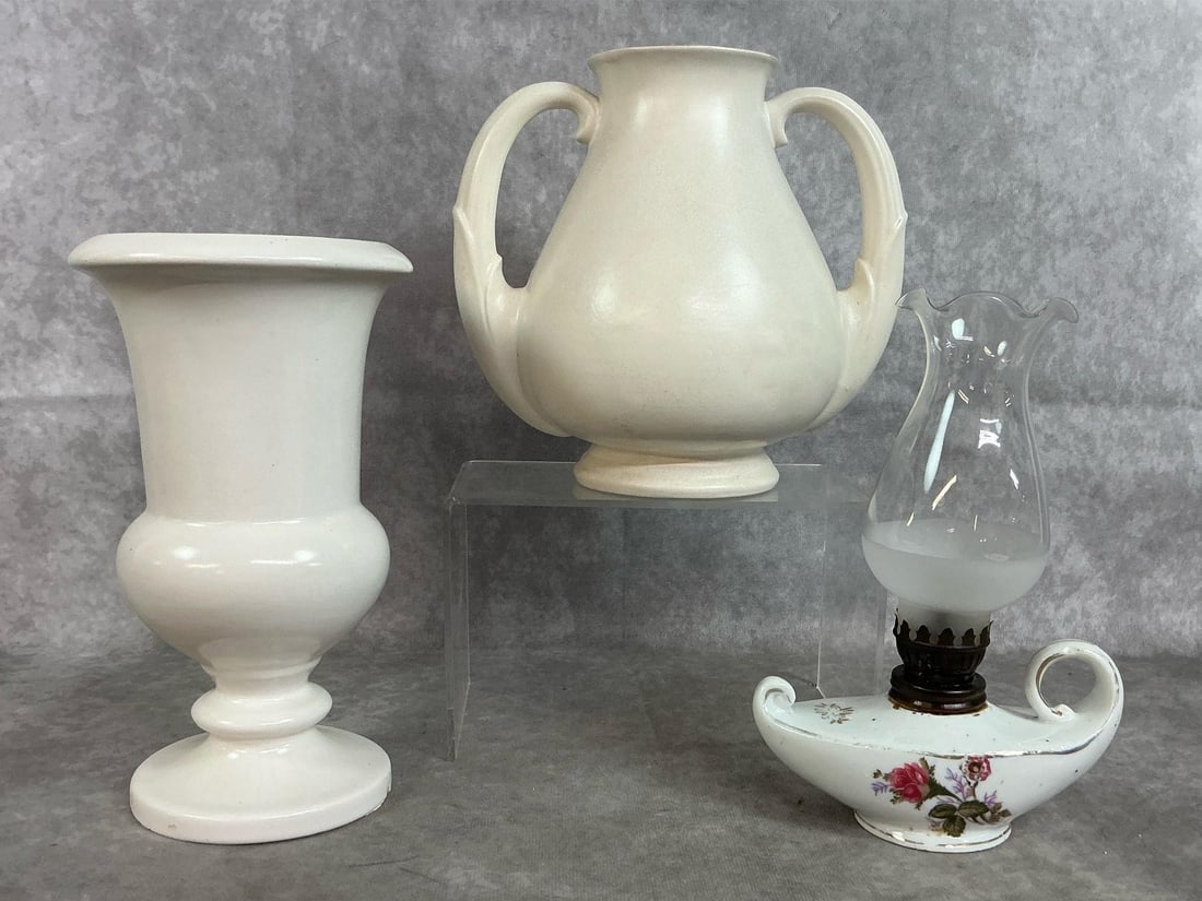 Roseville & Stangl Vases: Three early to mid 1900's vases and lamp. Roseville USA white art deco vase and Stangl #3111 art vase. Includes mini genie oil lamp with rose motif. Roseville vase has 2 small chips at base and mini