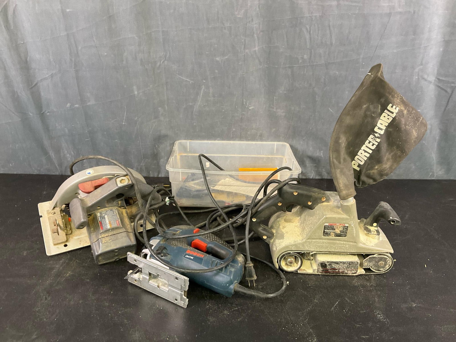 Power Tools: Circa 1990's Power Tools. One Porter Cable Model 362 Belt Sander 4 x 24 Whisper Series, working condition. One Bosch JS470E Jigsaw, working condition. One Skilsaw Circular Saw HD5657, Not tested,
