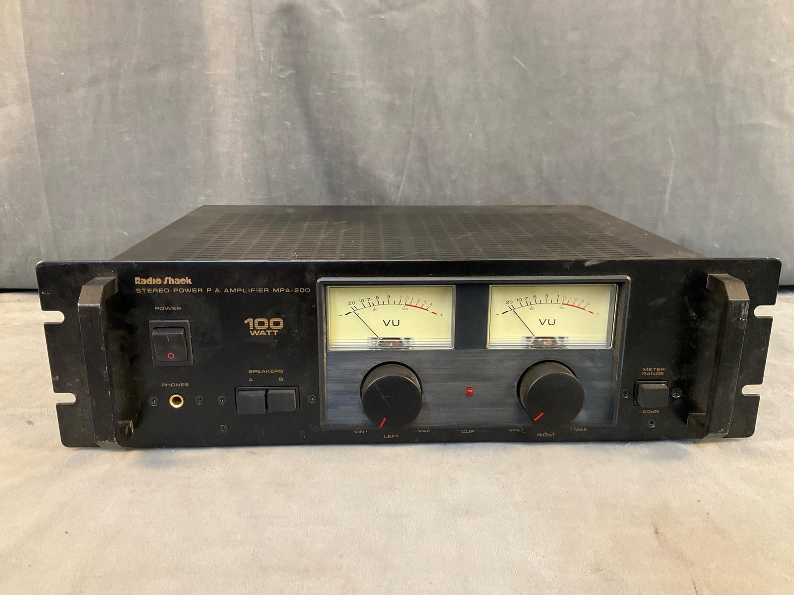 Stereo Amplifier: Circa 1990's Radio Shack MPA-200 CAT. NO: 32-3003 Stereo Power P.A. 100 Watt Amplifier. Serial No. 702619. Powers on, not tested. Measures 19 inches wide x 14.5 x 5.25 inches tall.