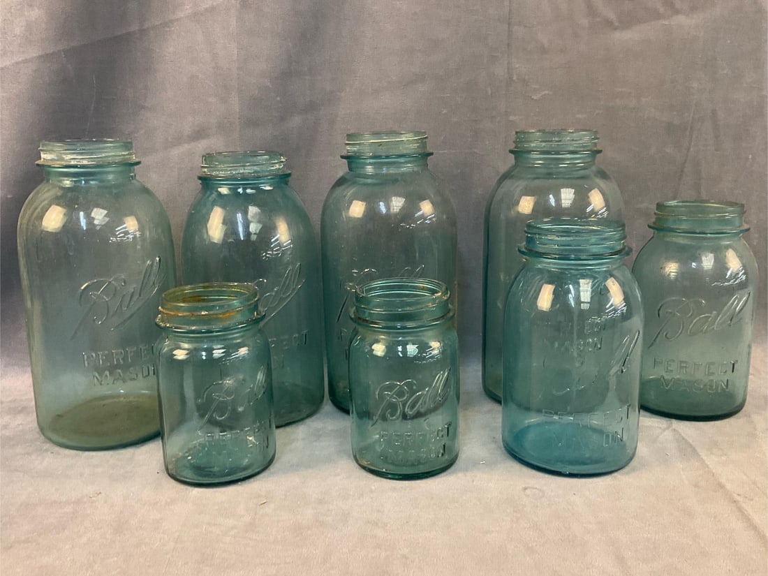 Mason Jars: Lot of eight early-mid 20th century "Ball Perfect Mason” Jars. One with crack, otherwise good condition. Smallest measures 3 inches in diameter x 5.25 inches tall.