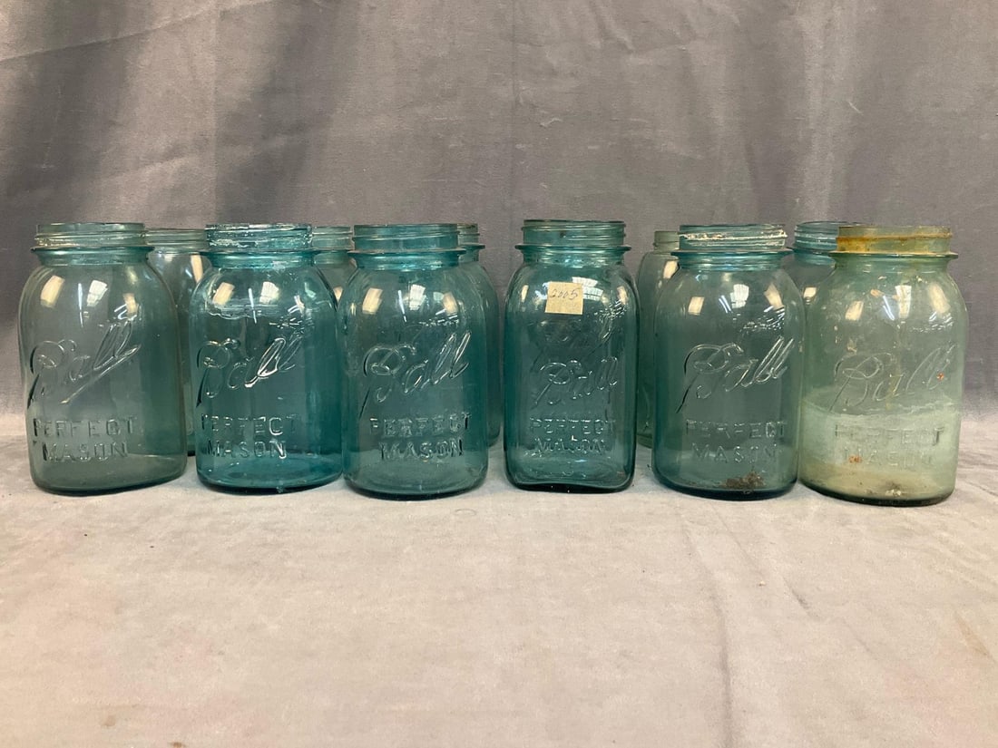 Mason Jars: Lot of twelve early-mid 20th century "Ball Perfect Mason” jars. One cracked, otherwise good used condition. Measures 4 inches in diameter x 6.75 inches tall.
