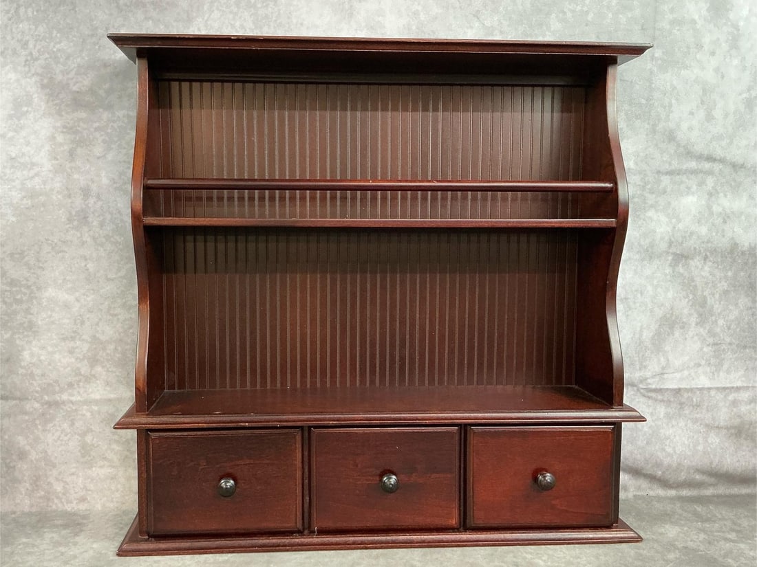Wooden Hutch with Drawers: Modern wooden hutch for wall mounting or stand alone. Dark wood, three drawer cabinet. A few small scratches, otherwise in good condition. Measures 22 inches wide x 5 x 21 inches tall.