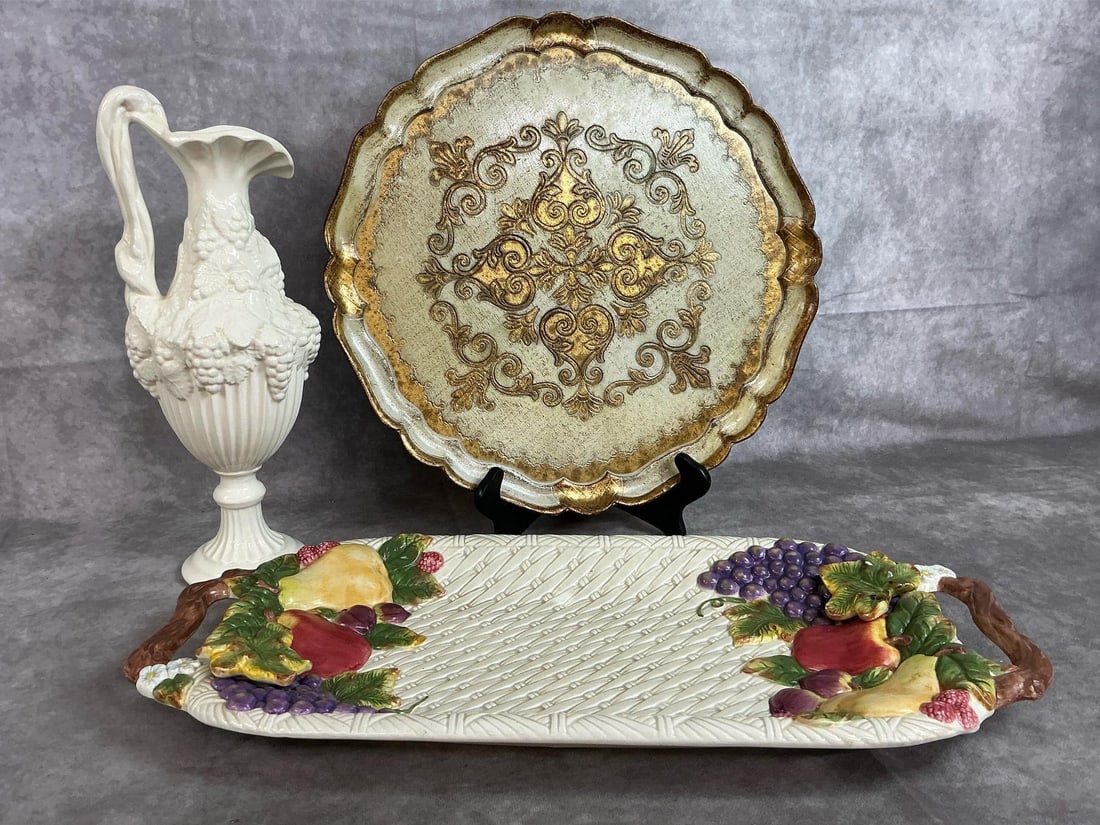 Collectible Trays & Pitcher: Three mid to late 1900's pieces. Baum Brothers Cornucopia collection long ceramic tray, wooden Italian Florentine round tray, and Arnel's ceramic pitcher. Long tray has a small chip out of a leaf,
