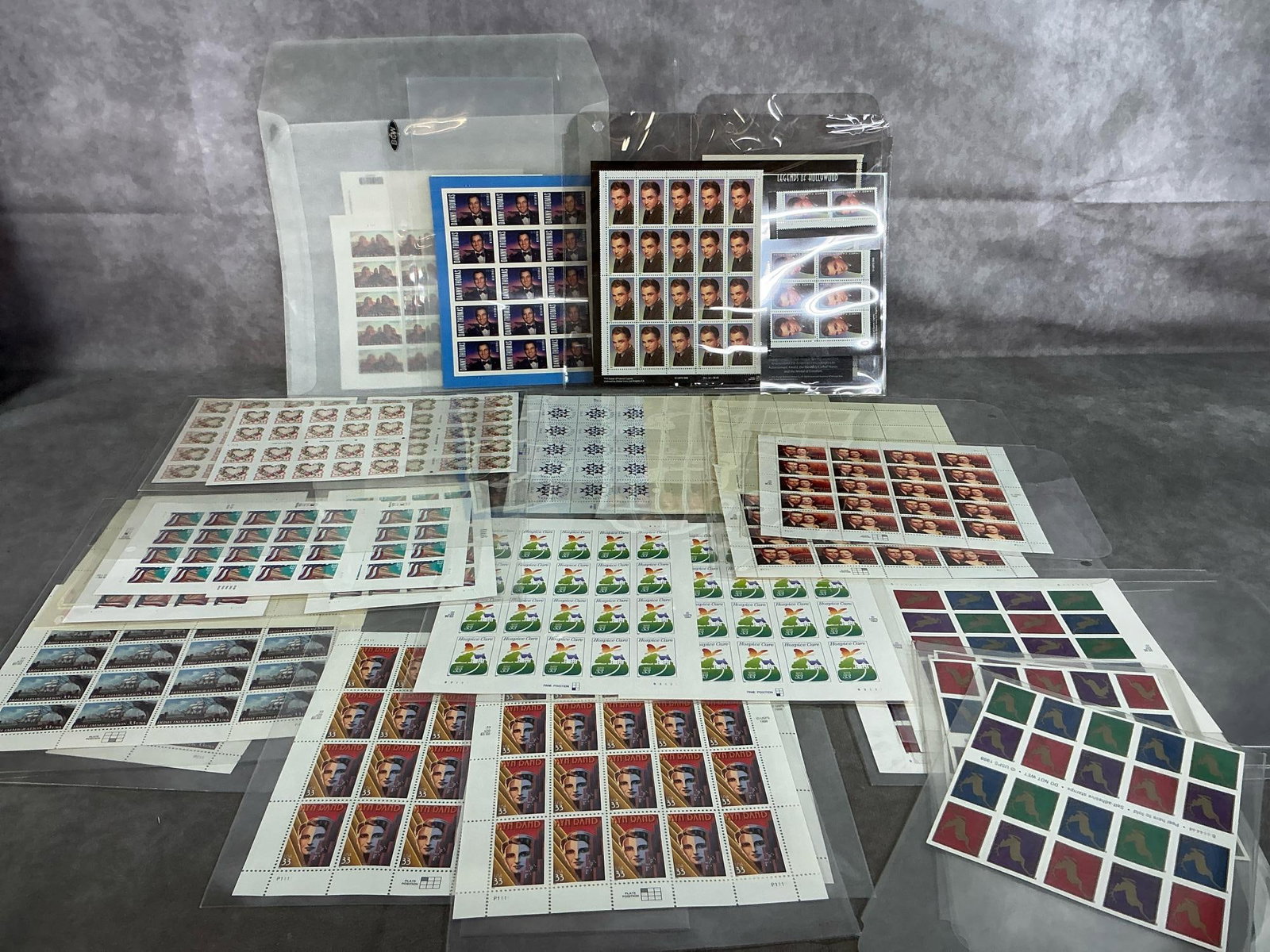 Assorted Sheets of Stamps: Over 650 thirty-three cent, forty-five cent, and Forever stamps from late 1990's. Most are in sheets or books of 20 count. Well preserved in plastic envelopes that measure up to 8.5 inches wide x 10
