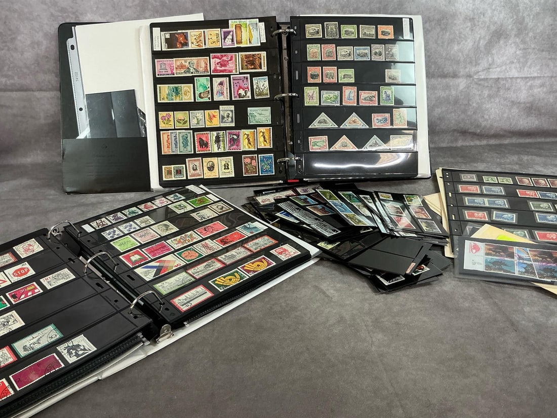 Stamps from Around the World: Hundreds of stamps from 1950's -1990's. Binder #1 contains stamps from Mediterranean Nations: Africa, Mid East, and Asia. Binder #2 has stamps from Germany, Czechoslovakia, Hungary, and more. Looses