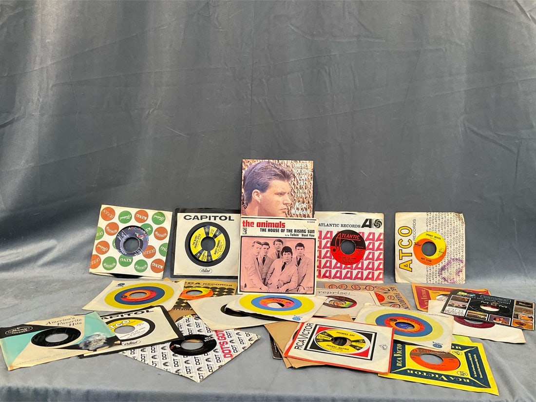 45 R.P.M. Records: Lot of twenty eight records mostly 1960's. Featuring; The Everly Brothers (Bye Bye Love), Rick Nelson, The Animals (The House of the Rising Sun), Peggy Lee, John Denver (…Country Roads), The