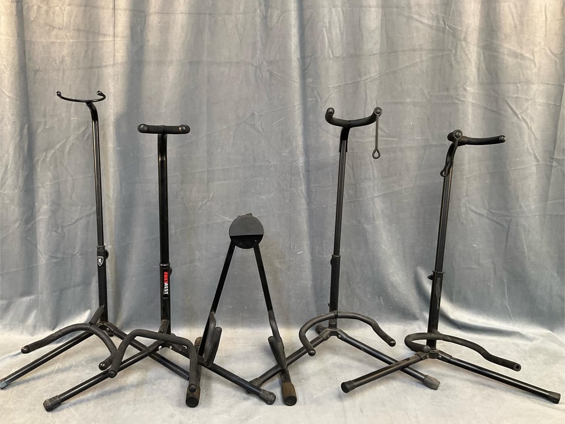 Guitar Stands: Lot of five contemporary Guitar Stands. One Guardian Stands, one Fretrest, one Quik Lok, two not labeled. Good used condition. Measures 19 inches wide x 12 x 28 inches tall.