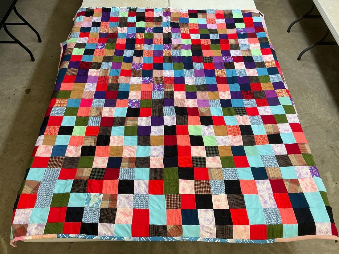 Patchwork Quilt: Vintage homemade patchwork quilt, machine stitched and hand quilted. Good condition. Measures 66 inches wide x 79 inches long.