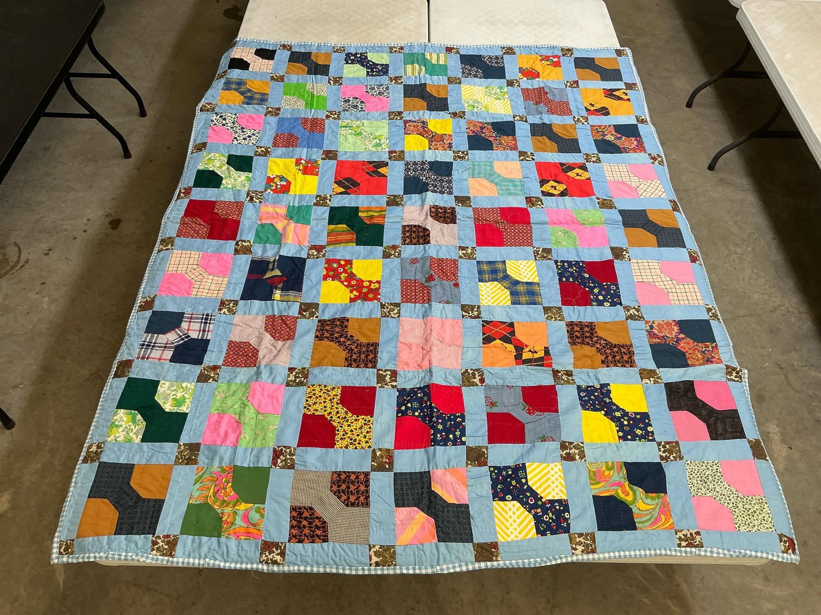 Bowtie Quilt: Vintage homemade bowtie pattern quilt, machine stitched and hand quilted. Good condition. Measures 63 inches wide x 78 inches long.