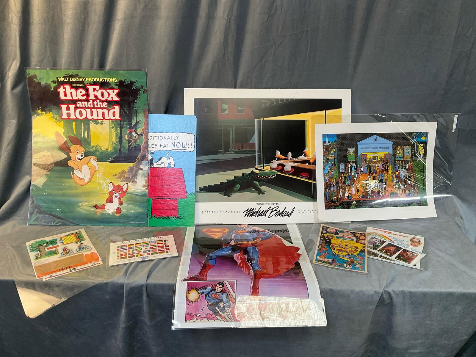 Vintage Assorted Posters: Late 20th lot of approximately nine vintage paper items consisting of; Walt Disney 1980 "The Fox and the Hound” poster, Superman poster, 1989 McDonald's Peanuts poster, 1989 Michael Bedard