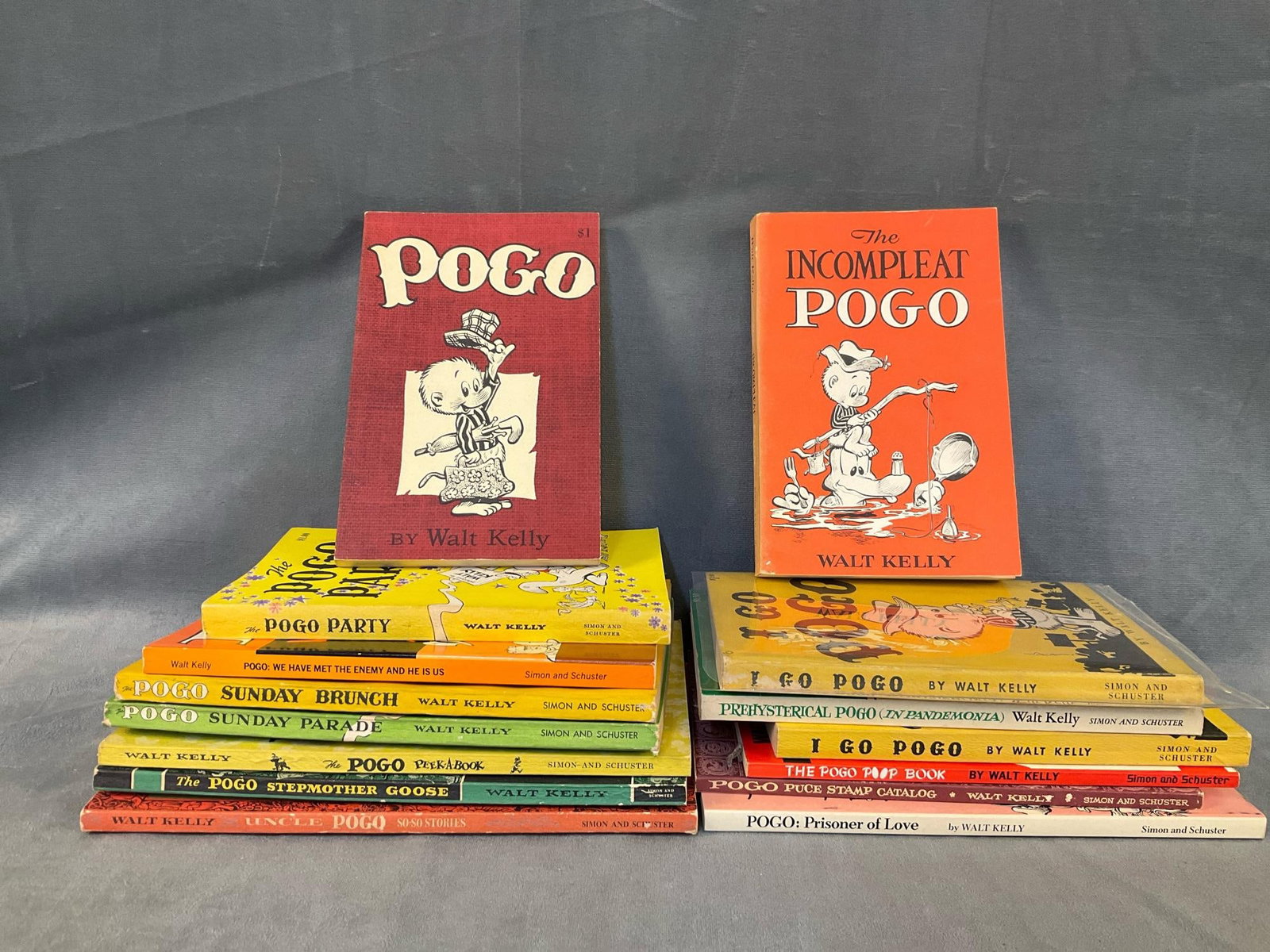 Pogo the Opposum Comic Paperbacks: Lot of fifteen 1950's-1960's Pogo paperback books by Walt Kelly. Good condition. Measures 6.75 inches wide x .5 x 9 inches tall.