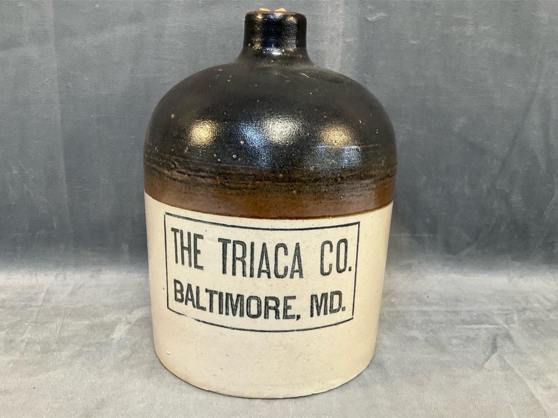 Baltimore Advertising Stoneware Jug: Circa 1900 Baltimore Liquor Merchant's Stoneware Jug with upper Albany slip glaze and lower Bristol glaze. Lower section with advertising "" THE TRIACA CO. / BALTIMORE,MD.". Good condition. Measures