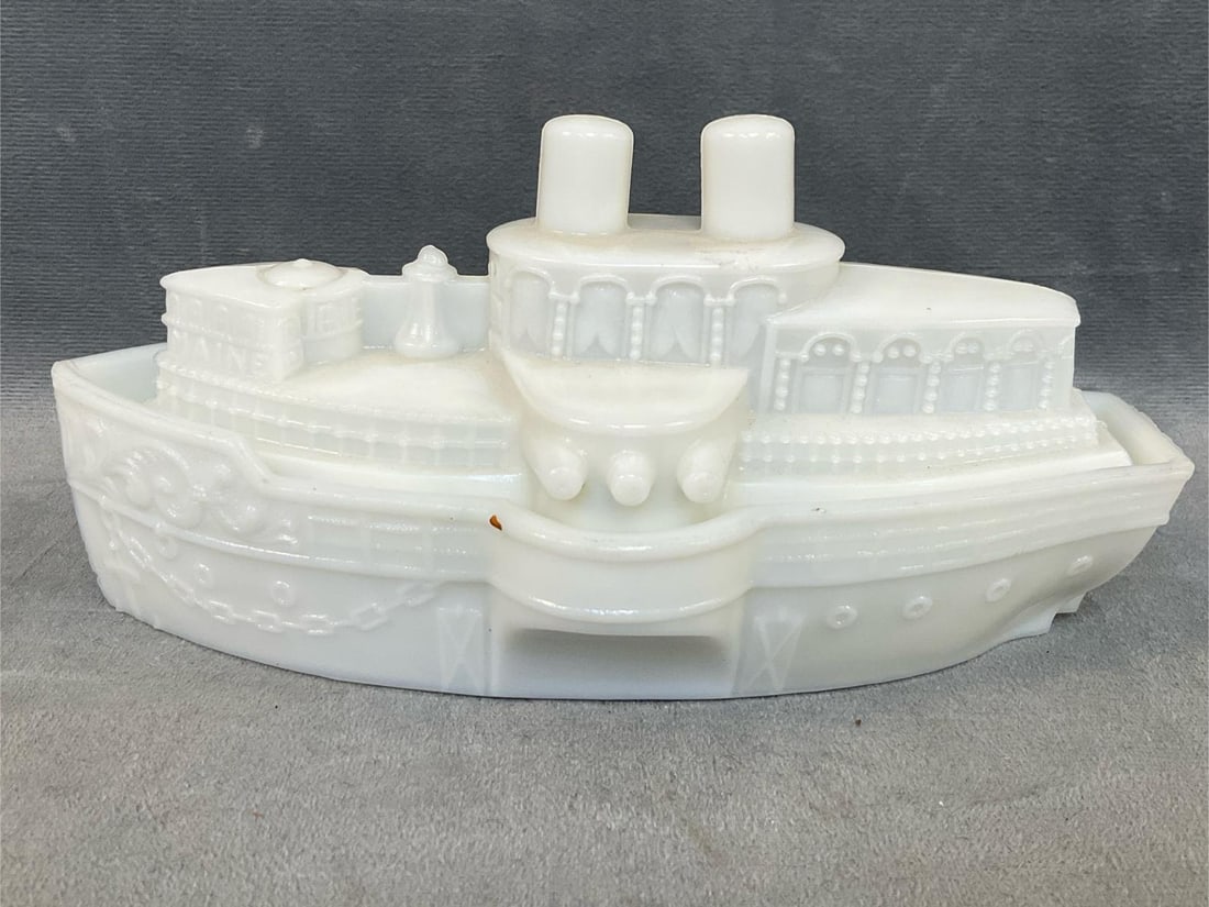 "The Maine" Milk Glass Battleship: Circa 1900 "Remember The Maine" Milk Glass Covered Dish in the form of the battleship U.S.S. Maine. The Maine was destroyed in 1898 in Havana Harbor initiating the Spanish-American War. Small chip to