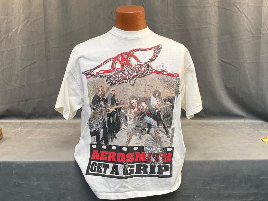 Aerosmith Concert T-Shirt: 1993 Aerosmith Band Get A Grip Tour Heavy Weight 100% Cotton XXL Tee Shirt. Image on both front and back. Good condition. Measures approximately 23 inches wide from underarm to underarm.