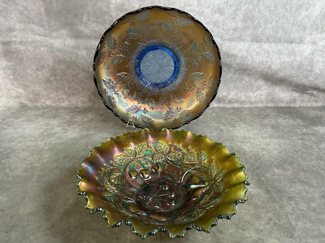 Fenton Carnival Glass: Two unmarked carnival glass bowls. Blue carnival glass with Holly design. Green, gold and purple tinged ruffled bowl. Both have wear but in overall good condition. Ruffled bowl measures 8.25 inches