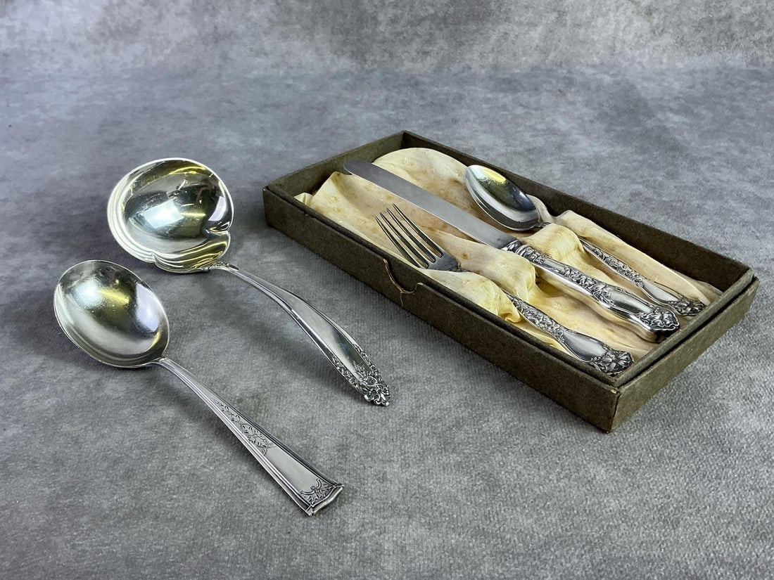 Sterling Mixed Utensils: Several sterling silver mixed pieces including Watrus Mfg. Co children's set. All in good condition, stamped with oxidation present. Total weight 4.88 ozt.