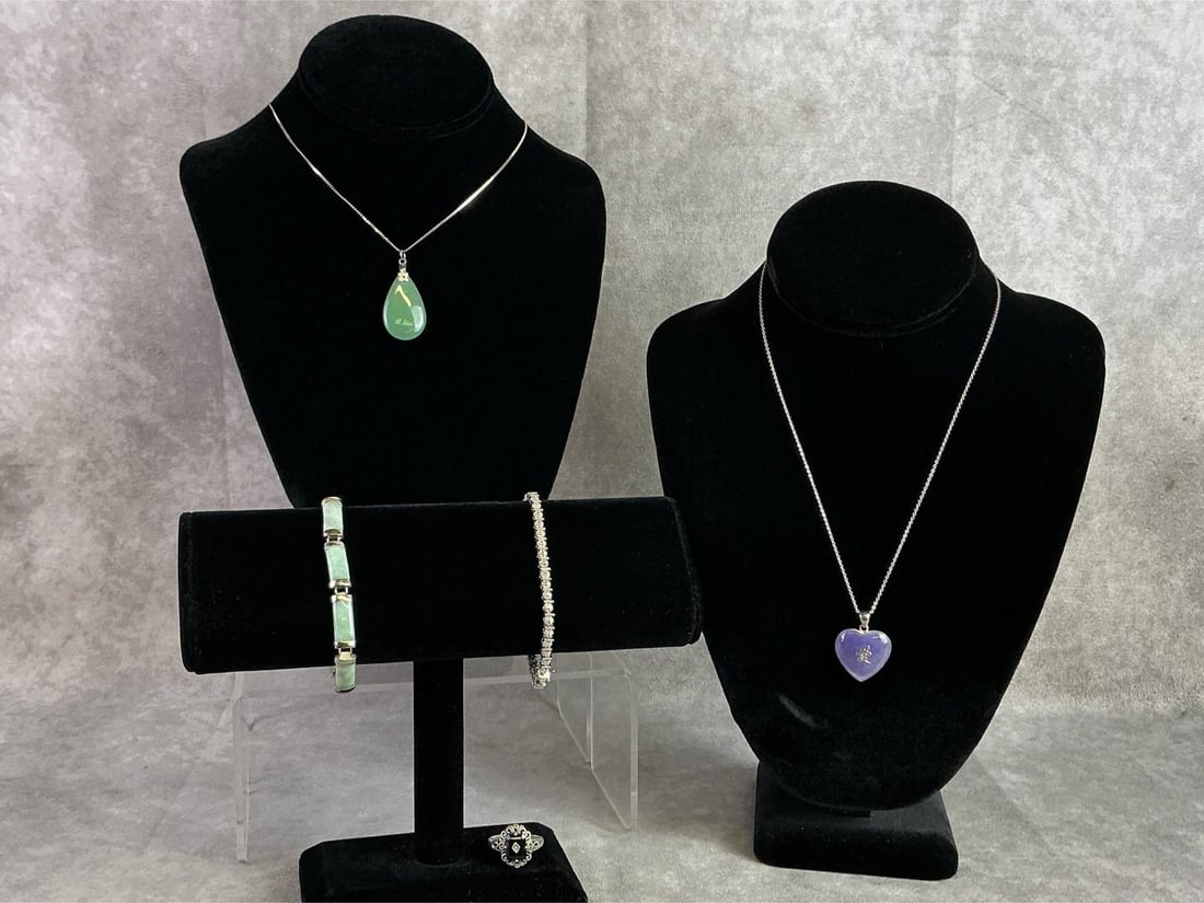 Sterling Silver Jewelry: Sterling silver jewelry including two necklaces with stone pendants, two bracelets, and one ring. All in good condition with bracelet clasps being delicate and stamped with oxidation present