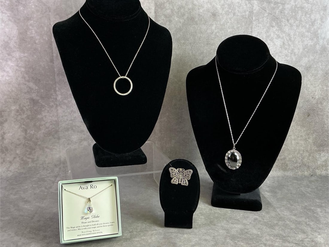 Sterling Silver Jewelry: Sterling silver jewelry including three necklaces and one brooch. All in good condition, stamped, and with oxidation present. Total weight 0.78 ozt.