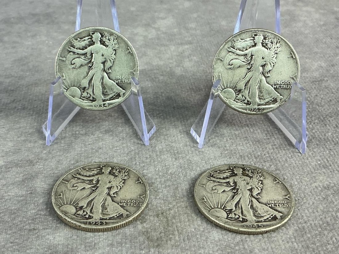 Walking Liberties: Four United States Walking Liberty Half Dollars dating from 1934 to 1945. All in good circulated condition. Total weight 1.56 ozt.