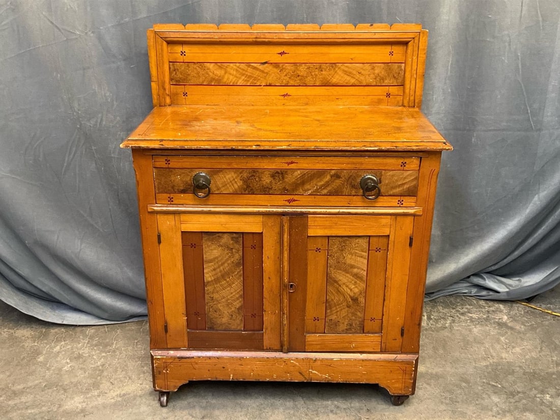 Victorian Washstand: Late 19th century Cottage Style one drawer over two washstand. Grain painted drawers with geometric design and brass pulls. Poplar and oak. Scratches, watermarks and overall wear, otherwise good