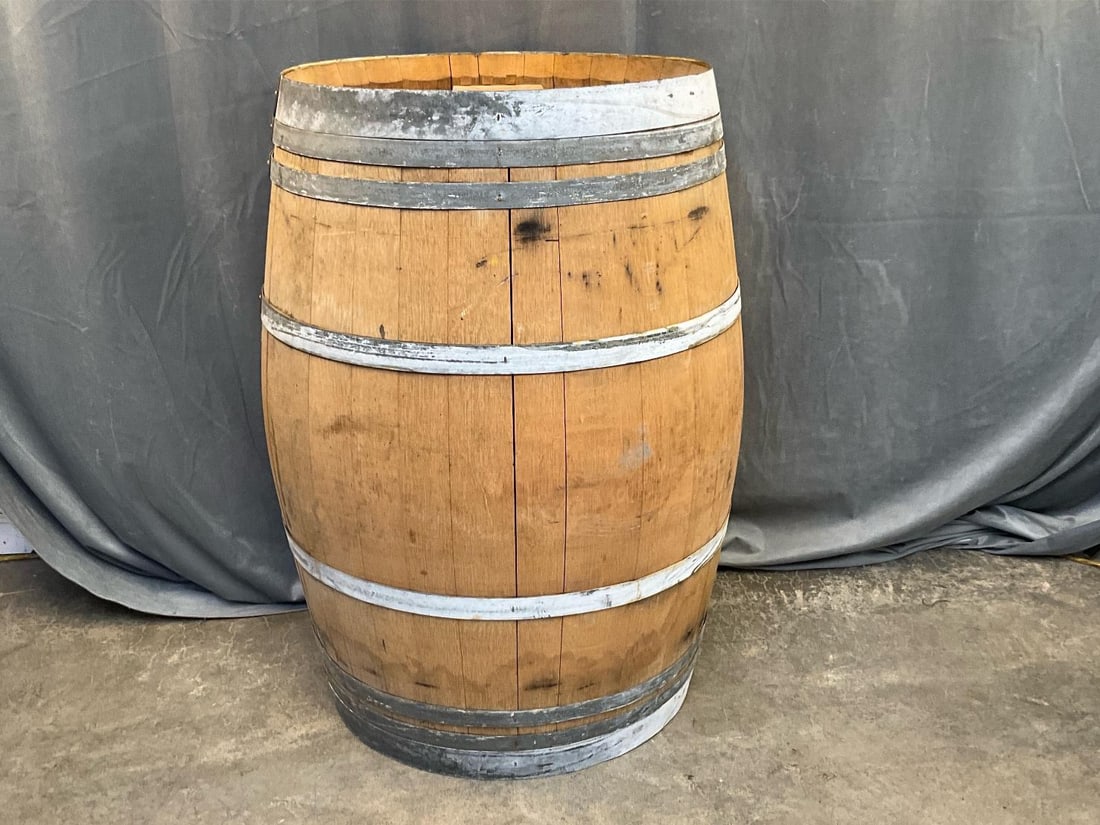 Demptos Wine Barrel: Contemporary circa early 2000's white oak staved and metal banded Demptos Bordeaux French wine barrel. Marked/Branded Demptos Bordeaux. With rubber stopper. Good used condition. Measures 24 inches in